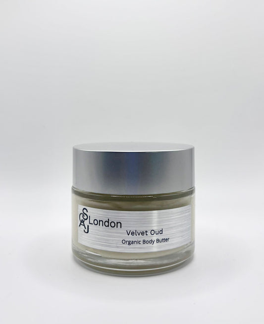Jar of 'Velvet Oud Organic Body Butter' from 'SCAJ London' on a white background